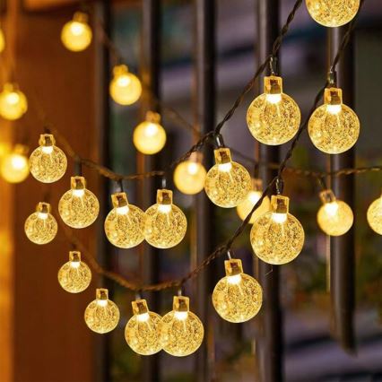 Dekoracyjny łańcuch solarny LED 50 diod / 8 funkcji 500 mAh 9,5 m IP67 ciepła biała