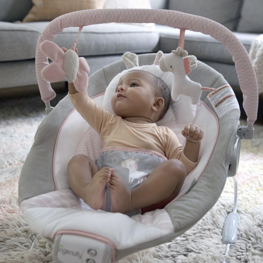 Ingenuity - Leżaczek wibracyjny dla dziecka z muzyką FLORA THE UNICORN 3xC