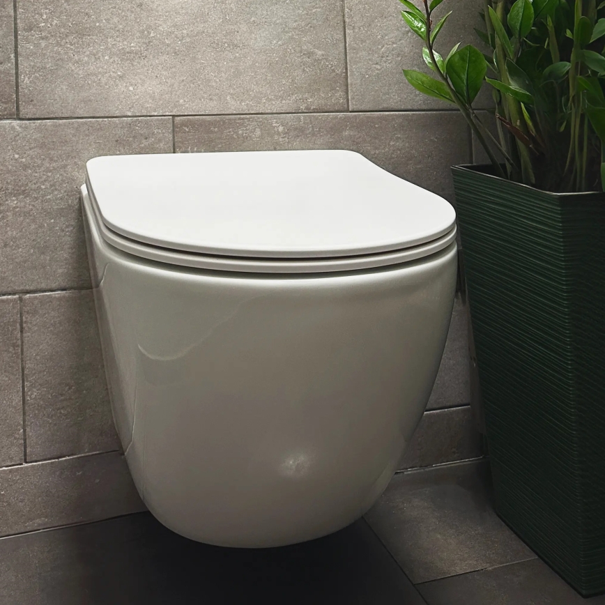 REA-C1259 - Wisząca miska WC z deską sedesową CARLO MINI TORNADO RIMLESS, ceramika / biały połysk
