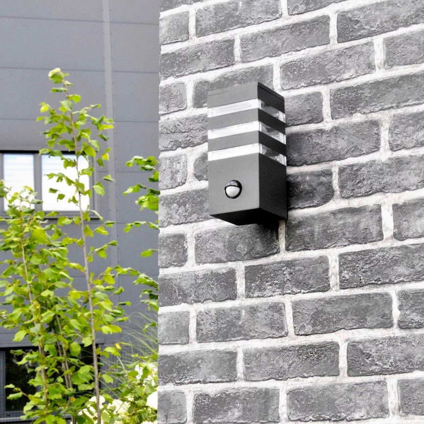 Zewnętrzna lampa ścienna z czujnikiem TEKSAS 1xE27/12W/230V IP44 antracyt